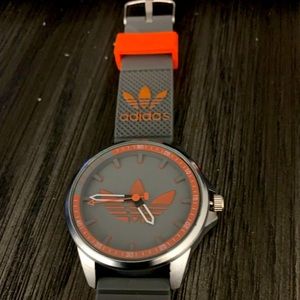 Adidas Labeled unisex sport watch with silicone wristband.